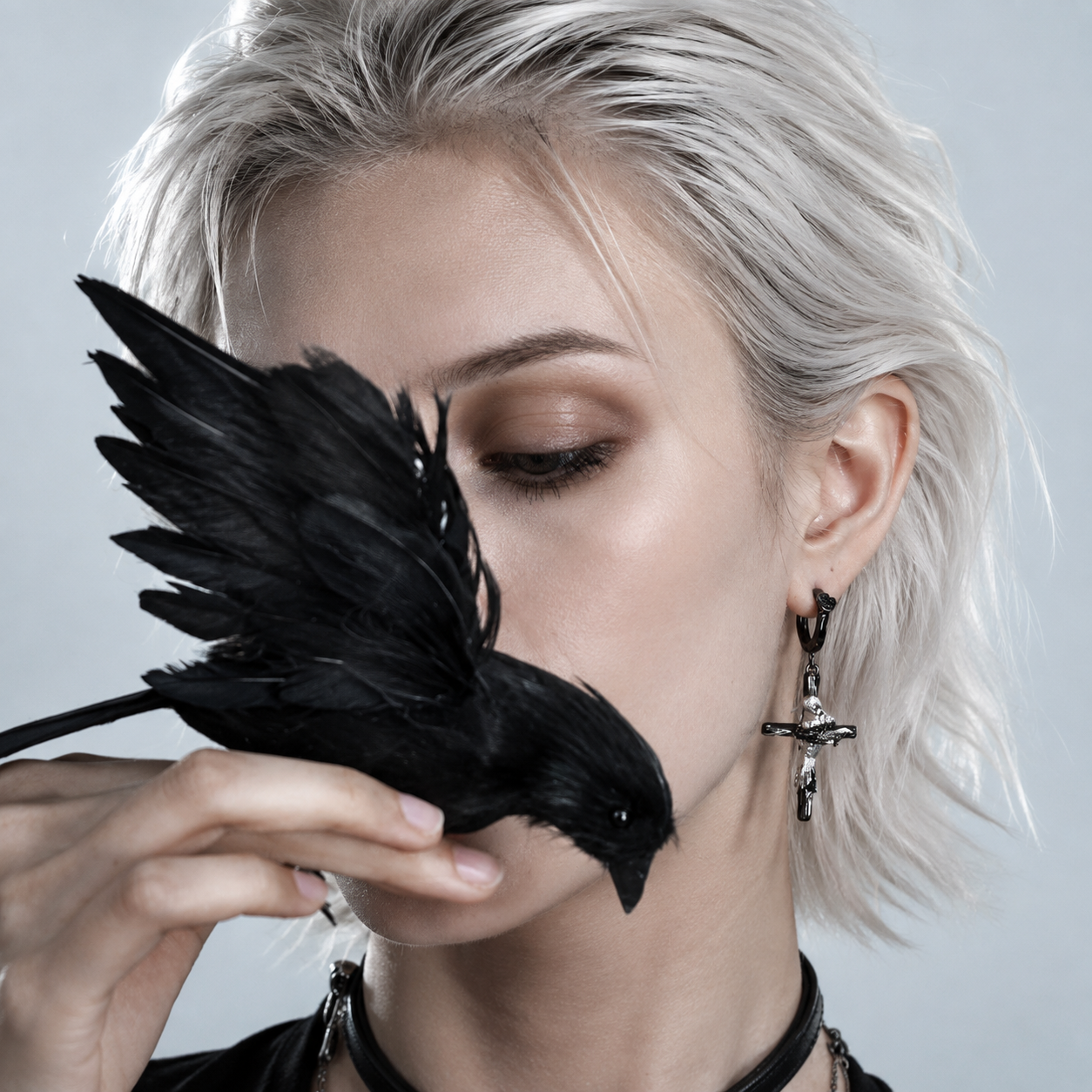 Raven Relic Cross Drop Earrings in black and silver – detail view