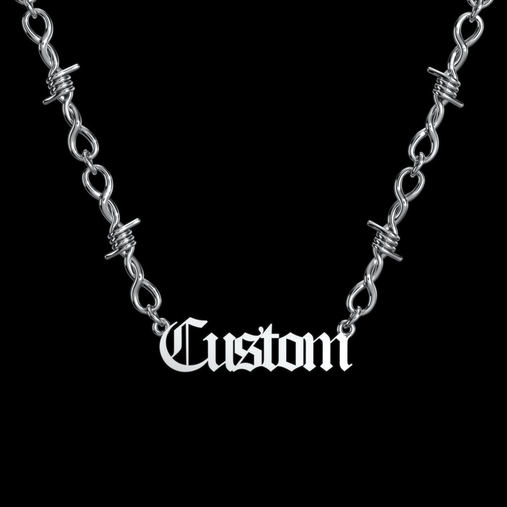 Custom barbed wire stainless steel name necklace on a black background