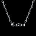 Custom barbed wire stainless steel name necklace on a black background