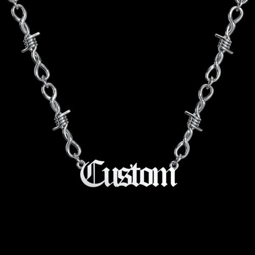 Custom barbed wire stainless steel name necklace on a black background
