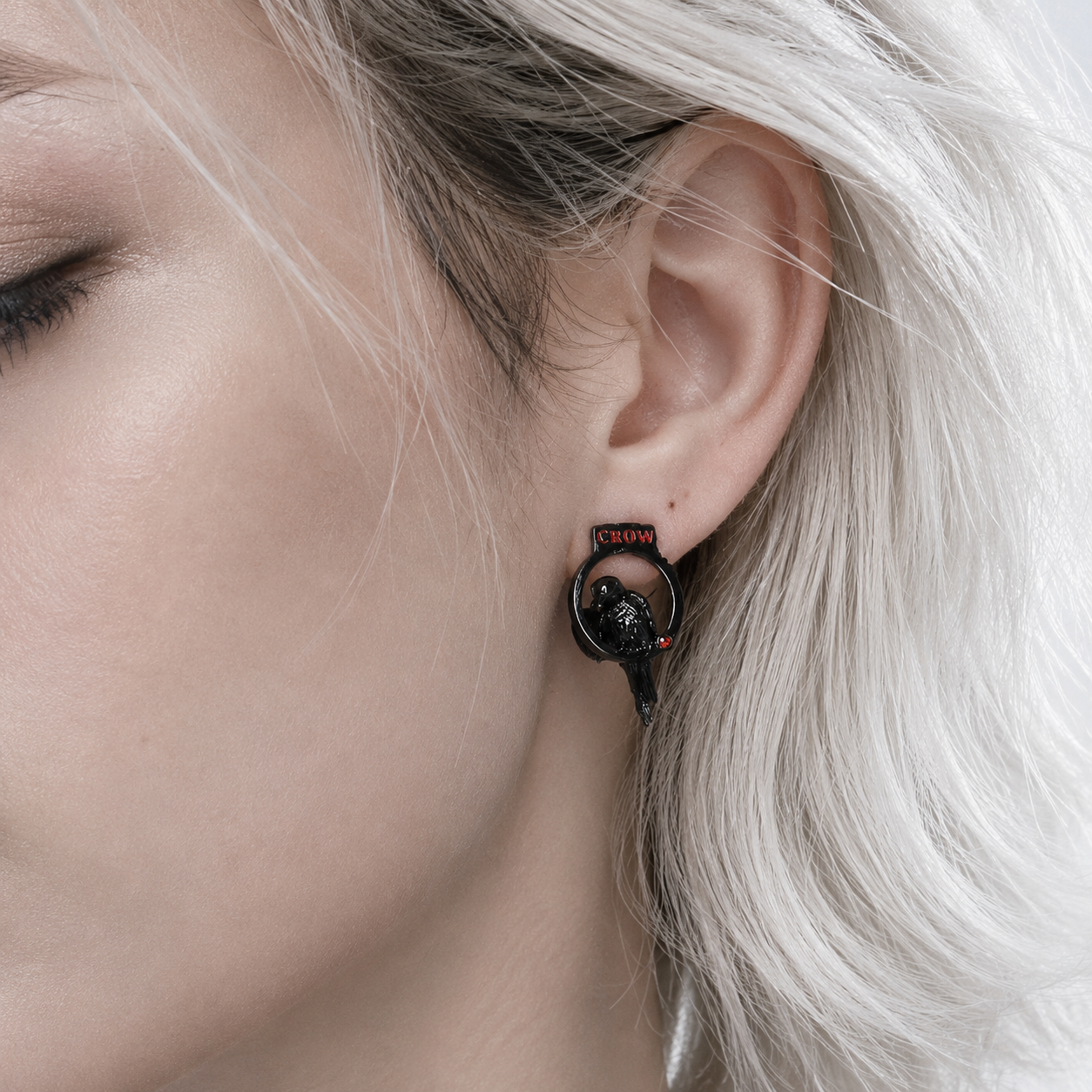 Crow Sigil Gothic Stud Earrings in black and silver – styling view