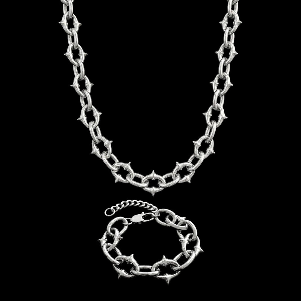 Berserk stainless steel jewelry set on a black background