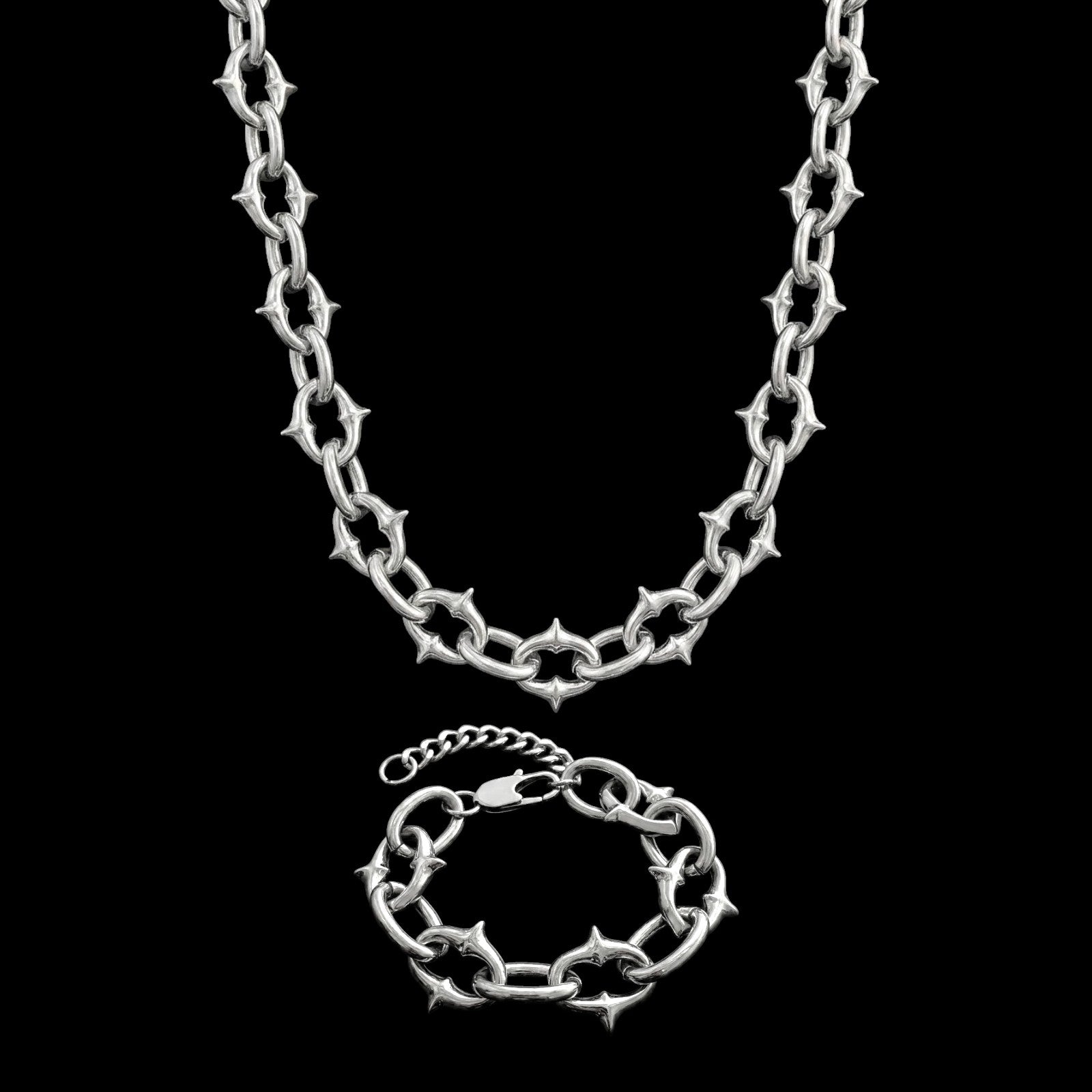 Berserk stainless steel jewelry set on a black background