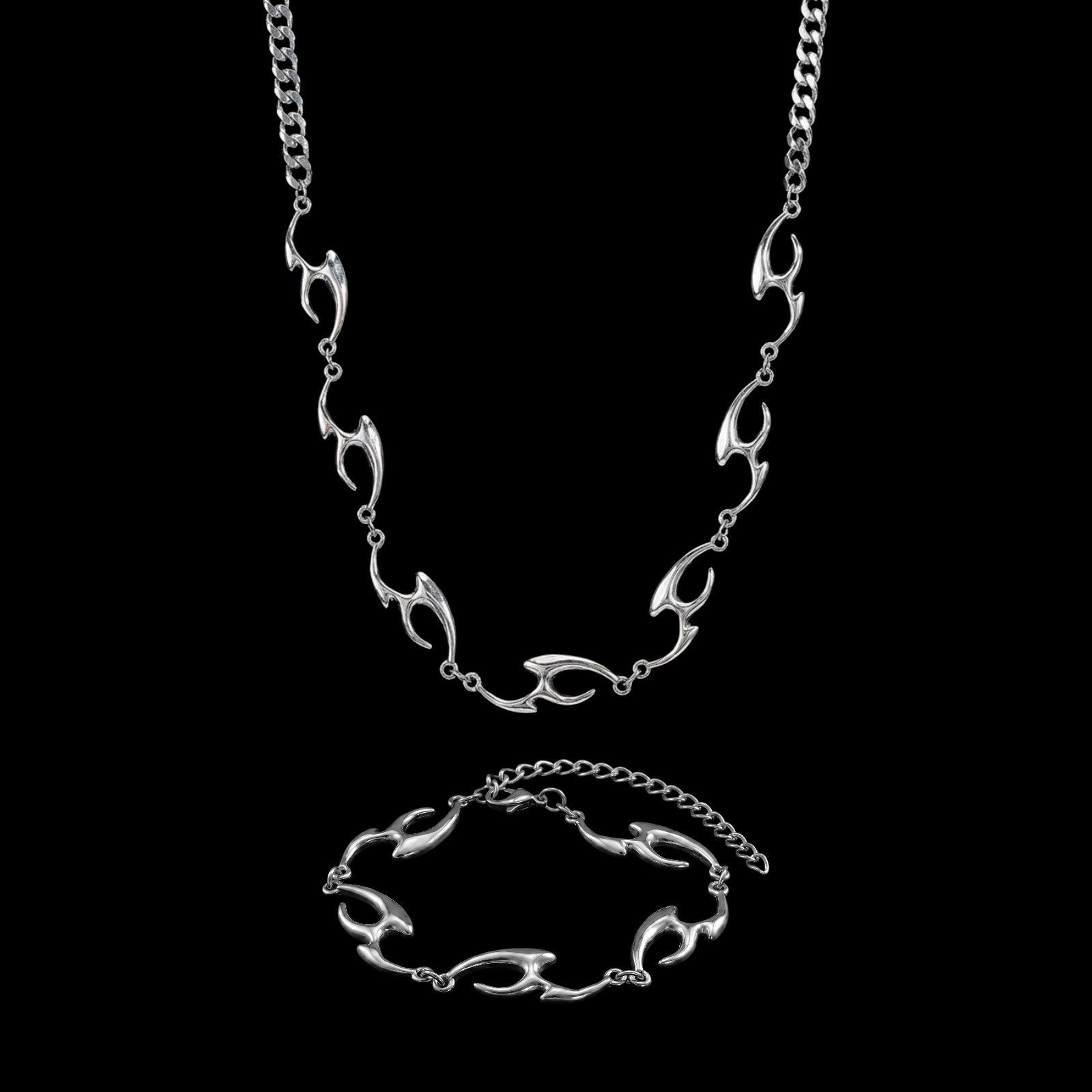 Lacerate stainless steel jewelry set on a black background