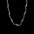 Razor stainless steel chain necklace on a black background