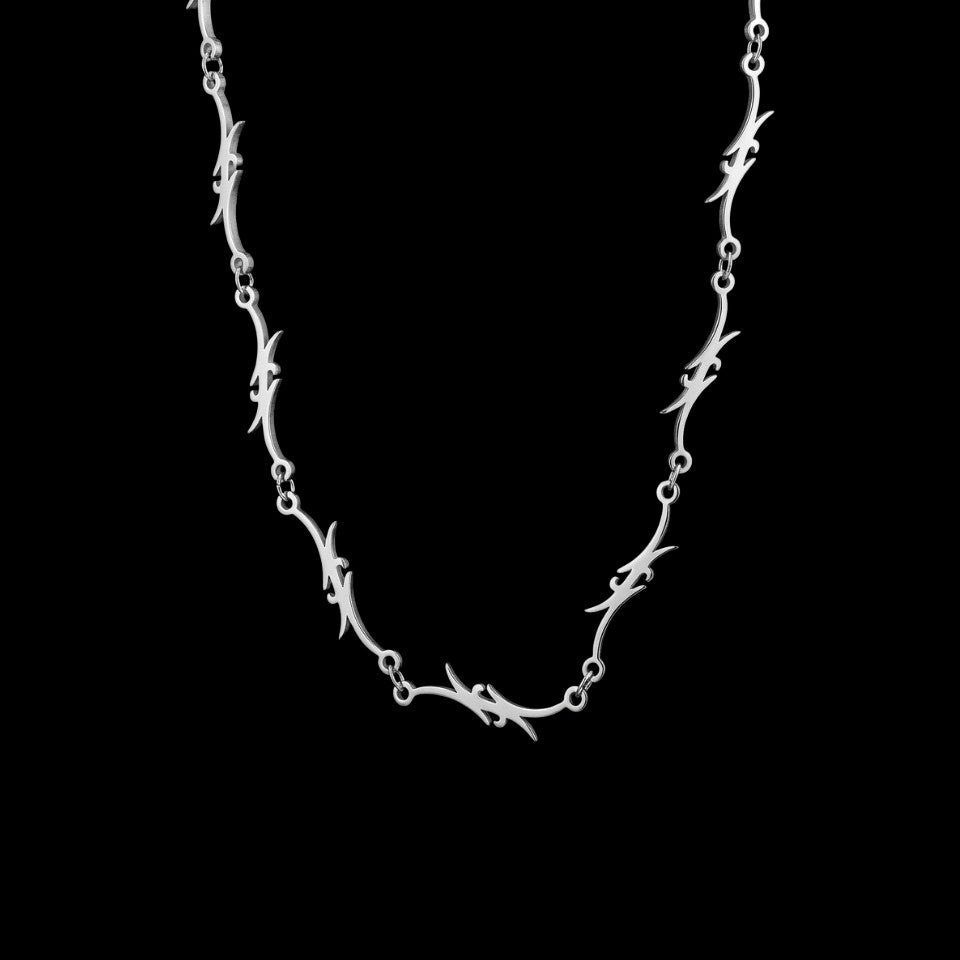 Razor stainless steel chain necklace on a black background