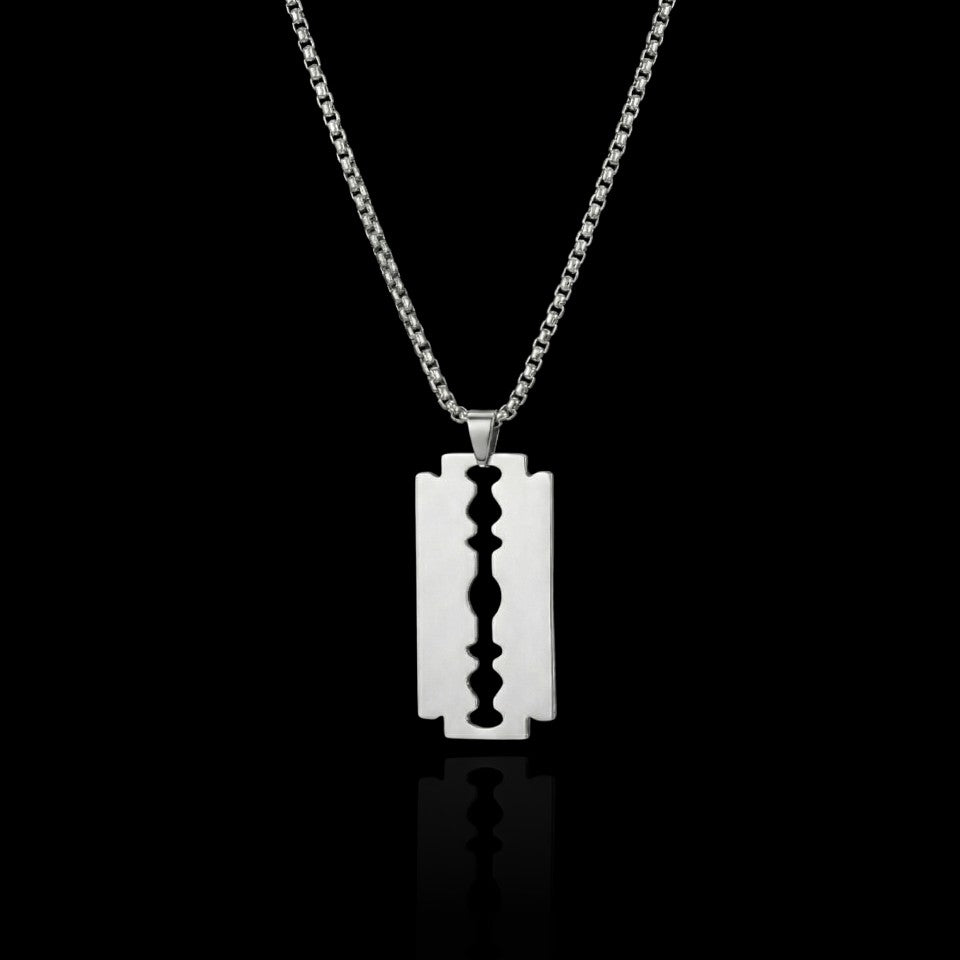 Razor blade stainless steel necklace on a black background