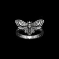 Duskwing stainless steel skull ring on a black background