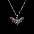 Blood moth gothic necklace with skull detail on a black background