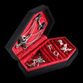 Coffin-shaped gothic jewelry box on a black background
