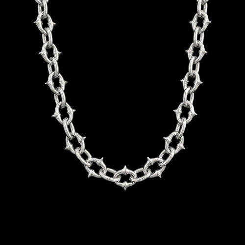 Berserk stainless steel chain necklace on a black background