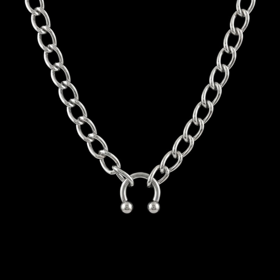 Riot stainless steel choker on a black background