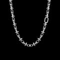 Rivet spiked stainless steel chain necklace on a black background