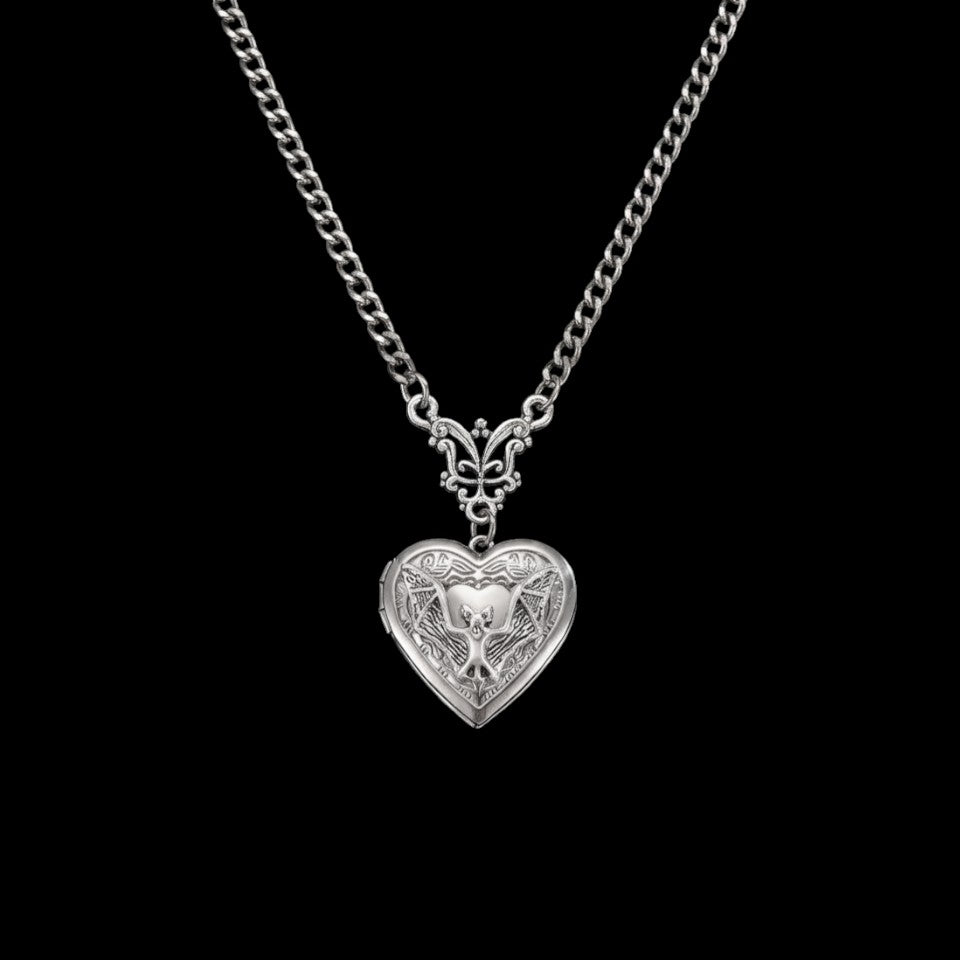 Bat locket stainless steel necklace on a black background