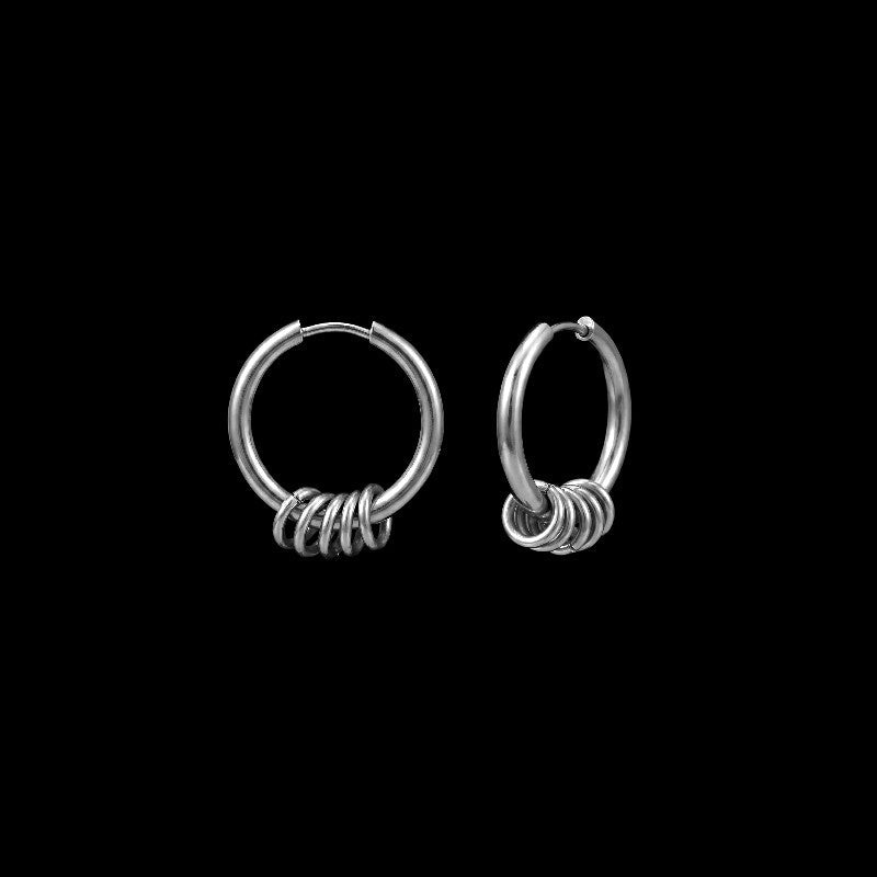 Shackle stainless steel hoop earrings on a black background