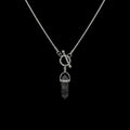 Onyx shard stainless steel necklace on a black background