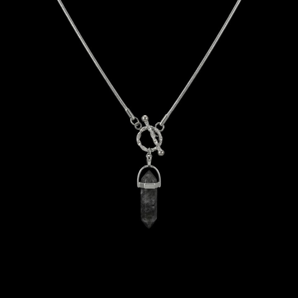 Onyx shard stainless steel necklace on a black background