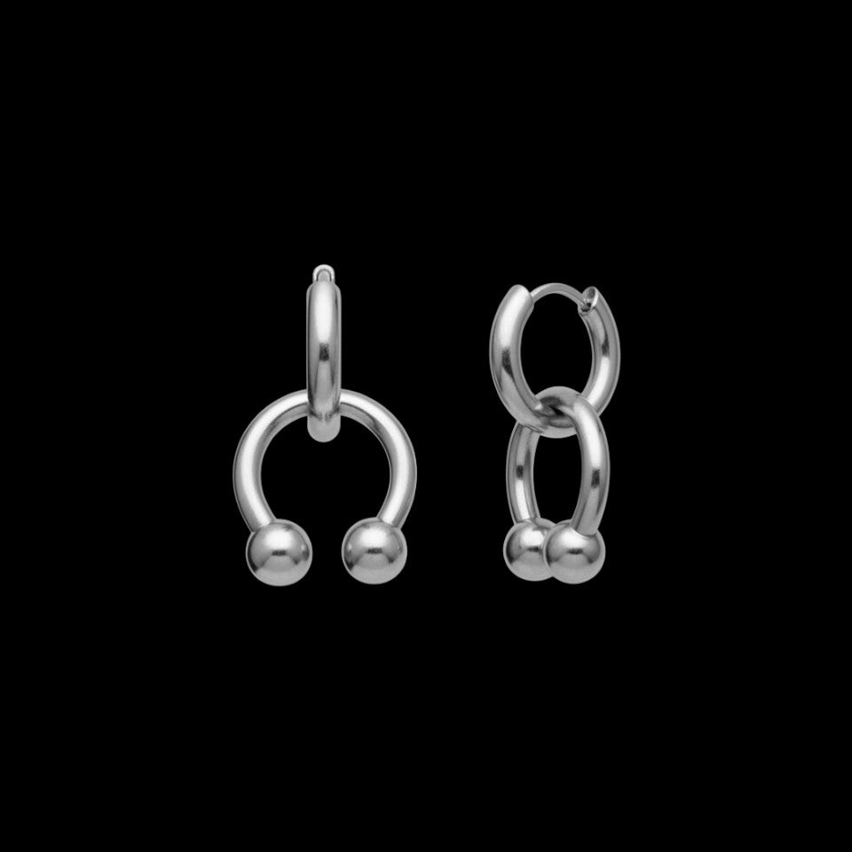 Horseshoe stainless steel hoop earrings on a black background