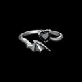 Bat wing sterling silver ring on a black background