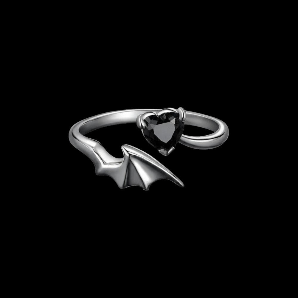 Bat wing sterling silver ring on a black background
