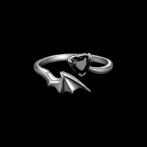 Bat wing sterling silver ring on a black background