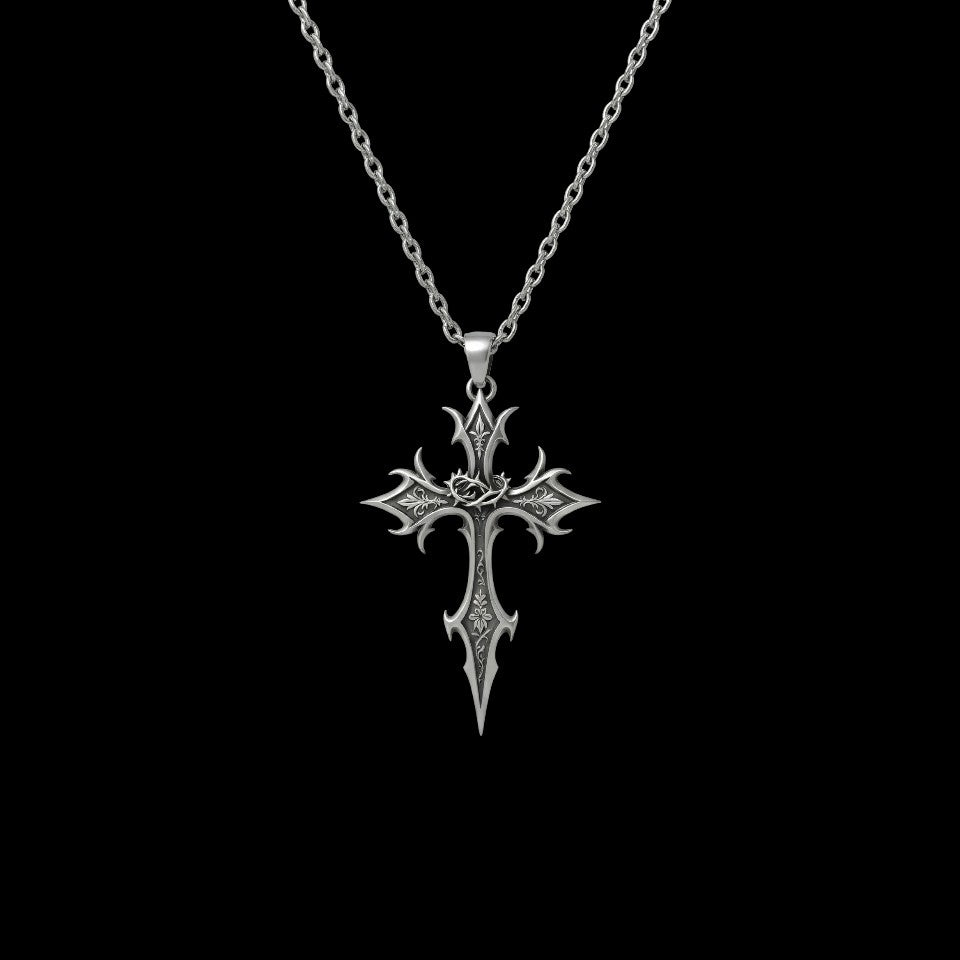 Crucible gothic stainless steel cross necklace on a black background