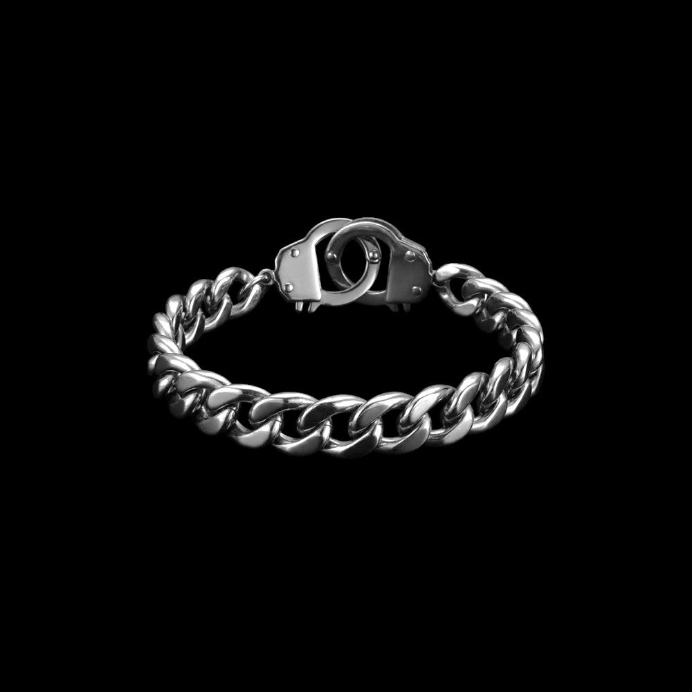 Handcuff stainless steel bracelet on a black background
