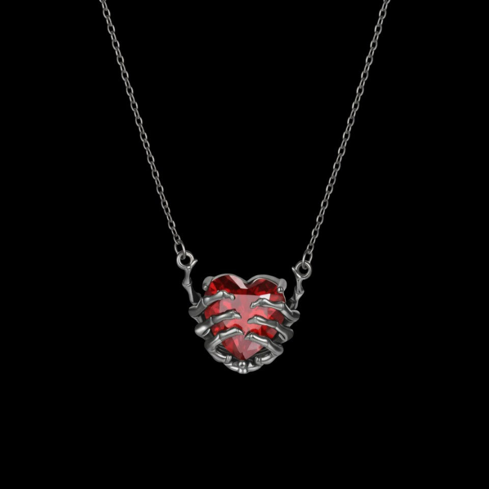 Dead Love red crystal heart necklace on a black background