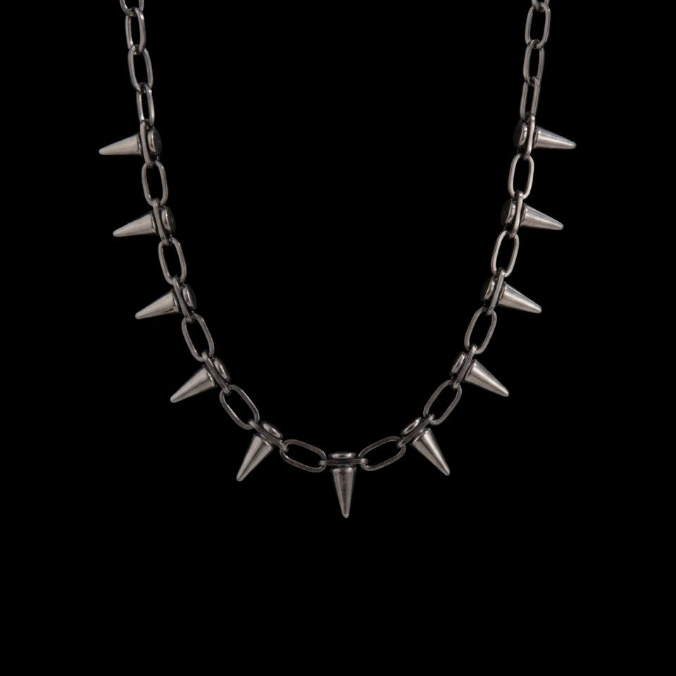 Spike stainless steel choker on a black background