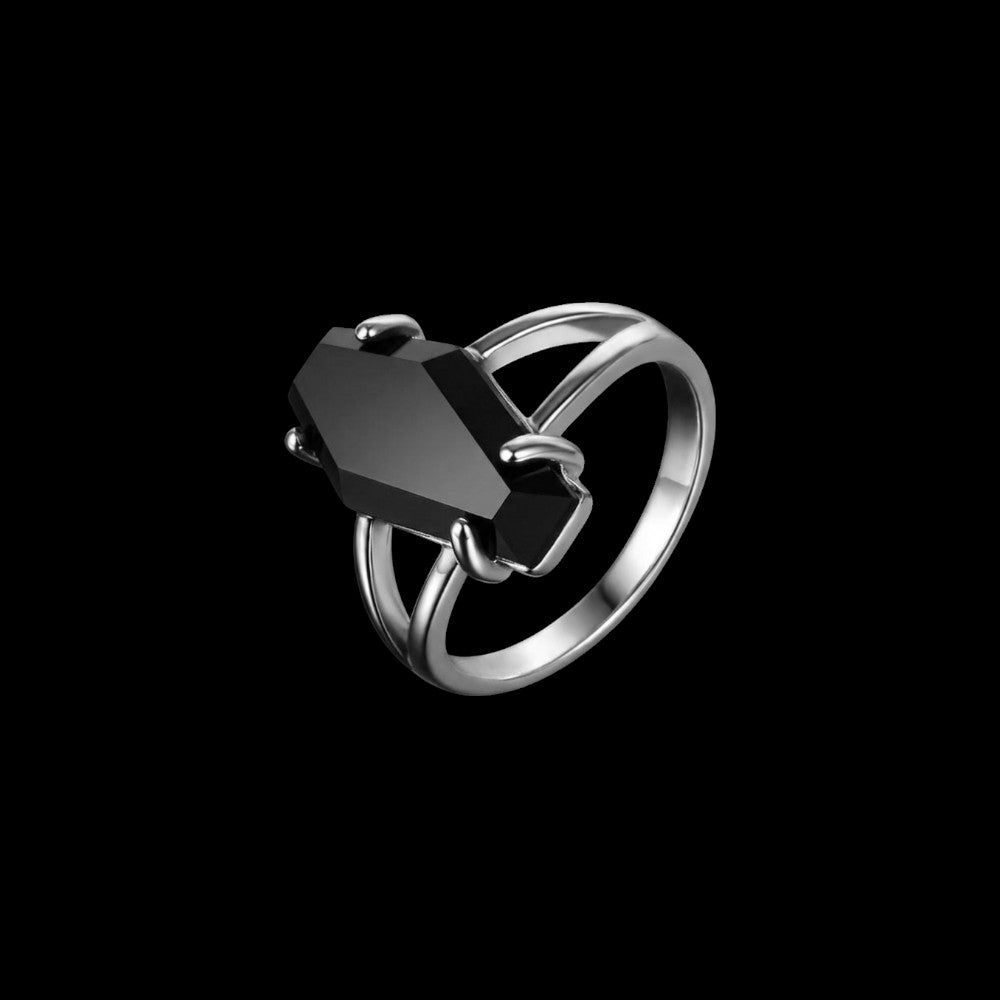 Coffin stainless steel ring on a black background