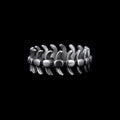 Vertebrae stainless steel ring on a black background