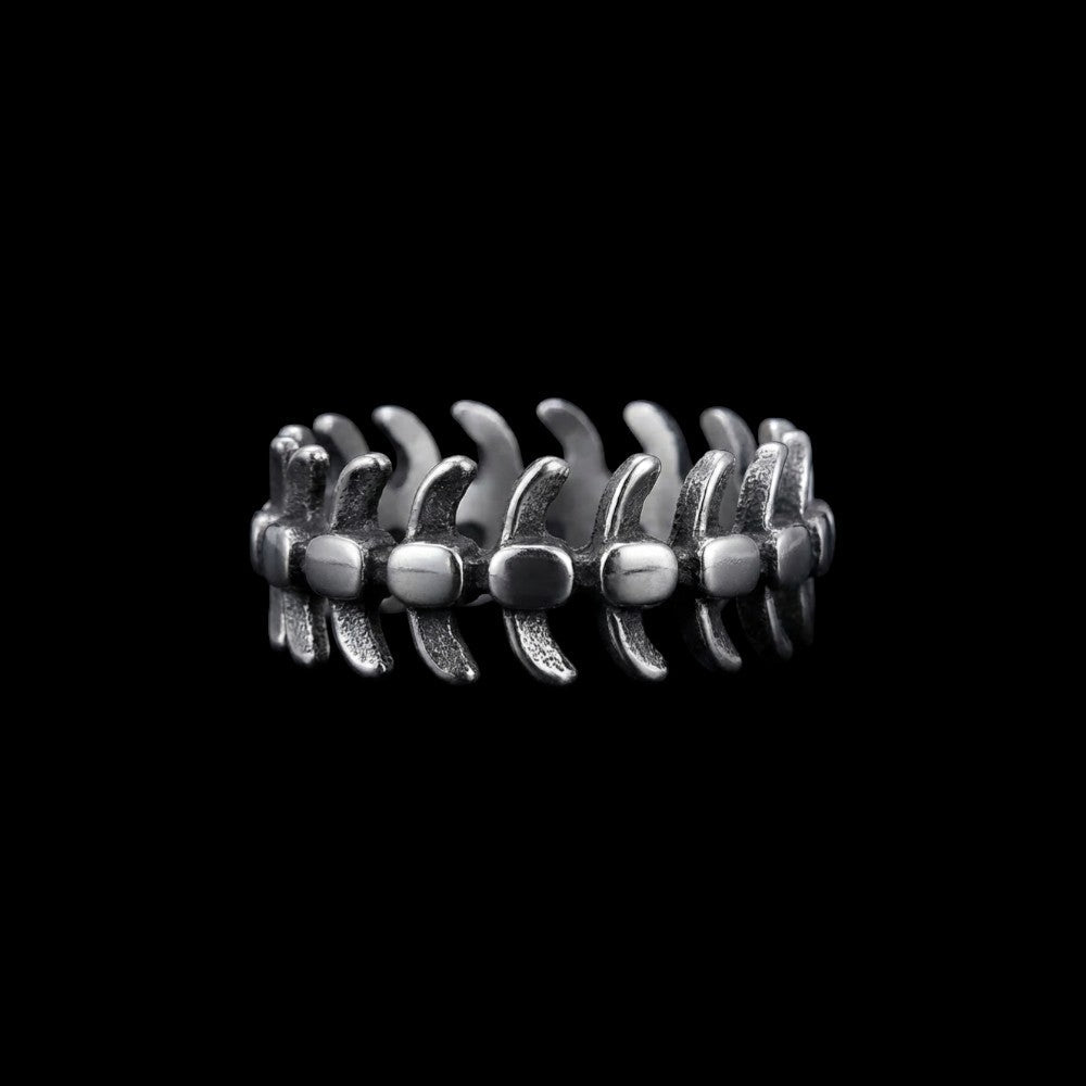 Vertebrae stainless steel ring on a black background