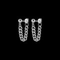 Lockdown stainless steel chain earrings on a black background