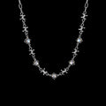 Opal barbed wire stainless steel necklace on a black background
