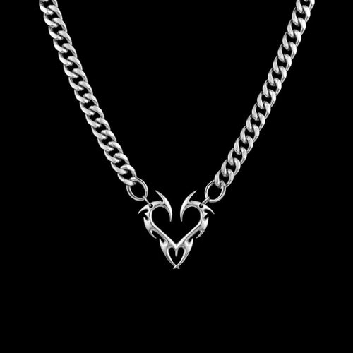 Barbed heart stainless steel necklace on a black background
