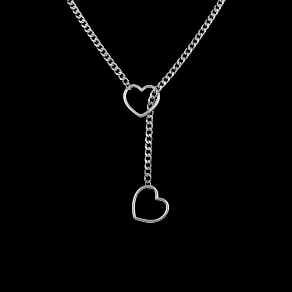 Heart slip stainless steel chain necklace on a black background