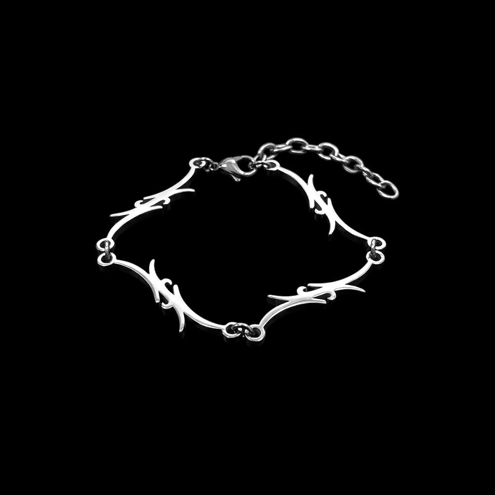 Razor stainless steel bracelet on a black background