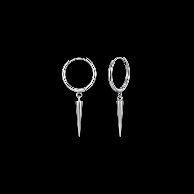 Spiked stainless steel hoop earrings in silver and gold on a black background