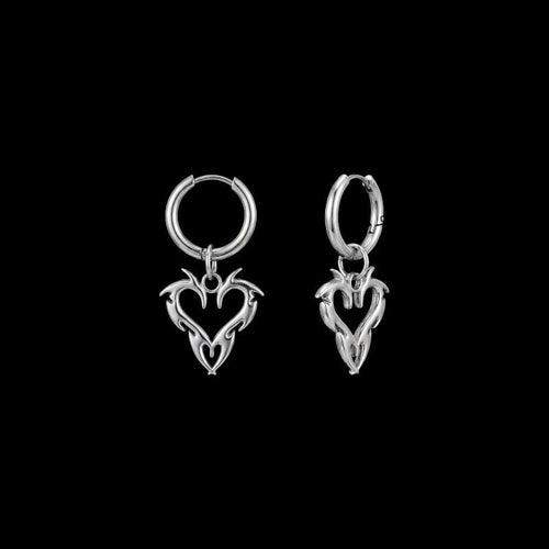 Barbed heart stainless steel hoop earrings on a black background