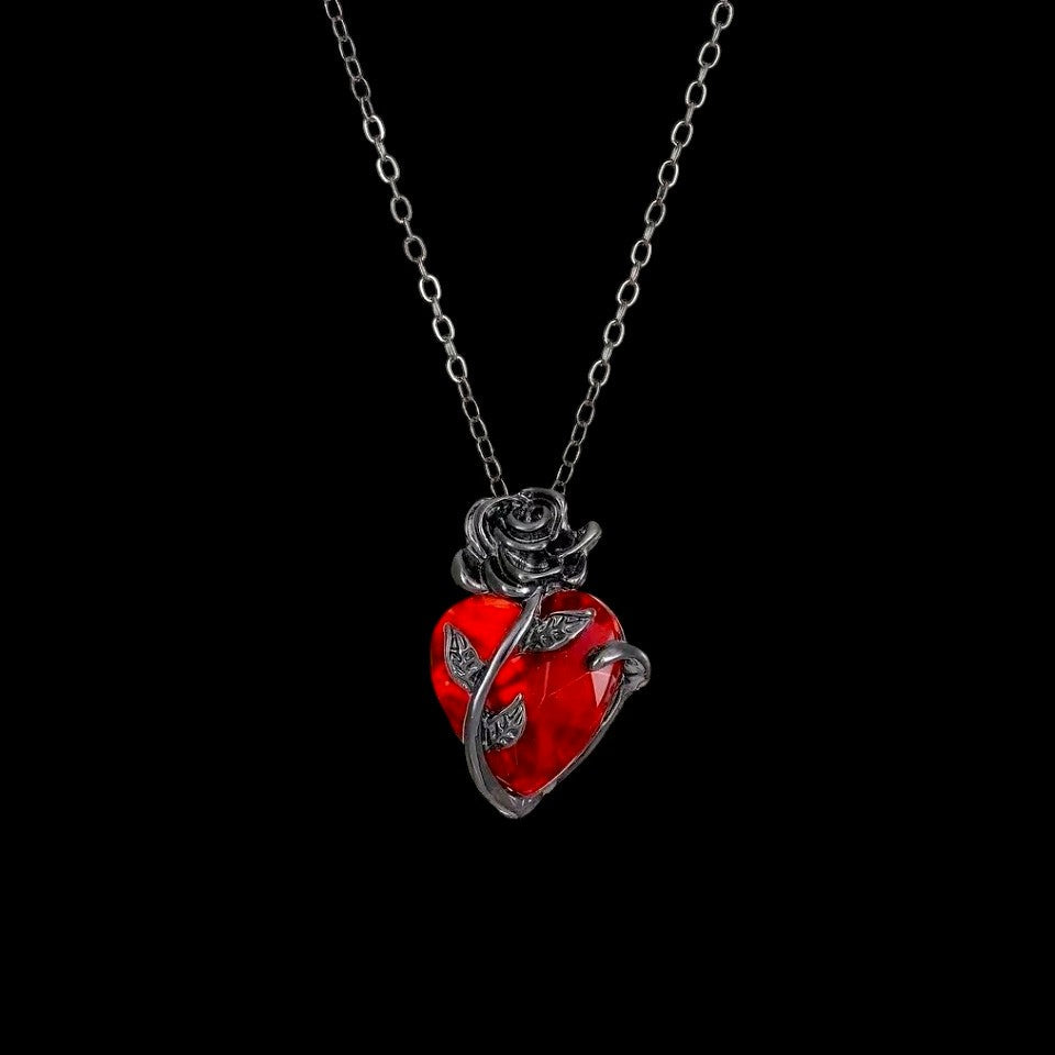 Blood rose red crystal necklace on a black background