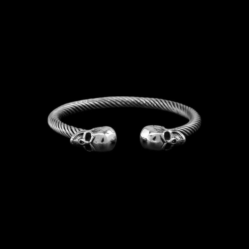 Mortal stainless steel skull bracelet on a black background