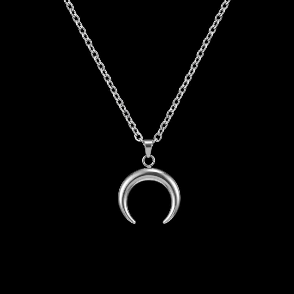 Crescent moon stainless steel necklace on a black background