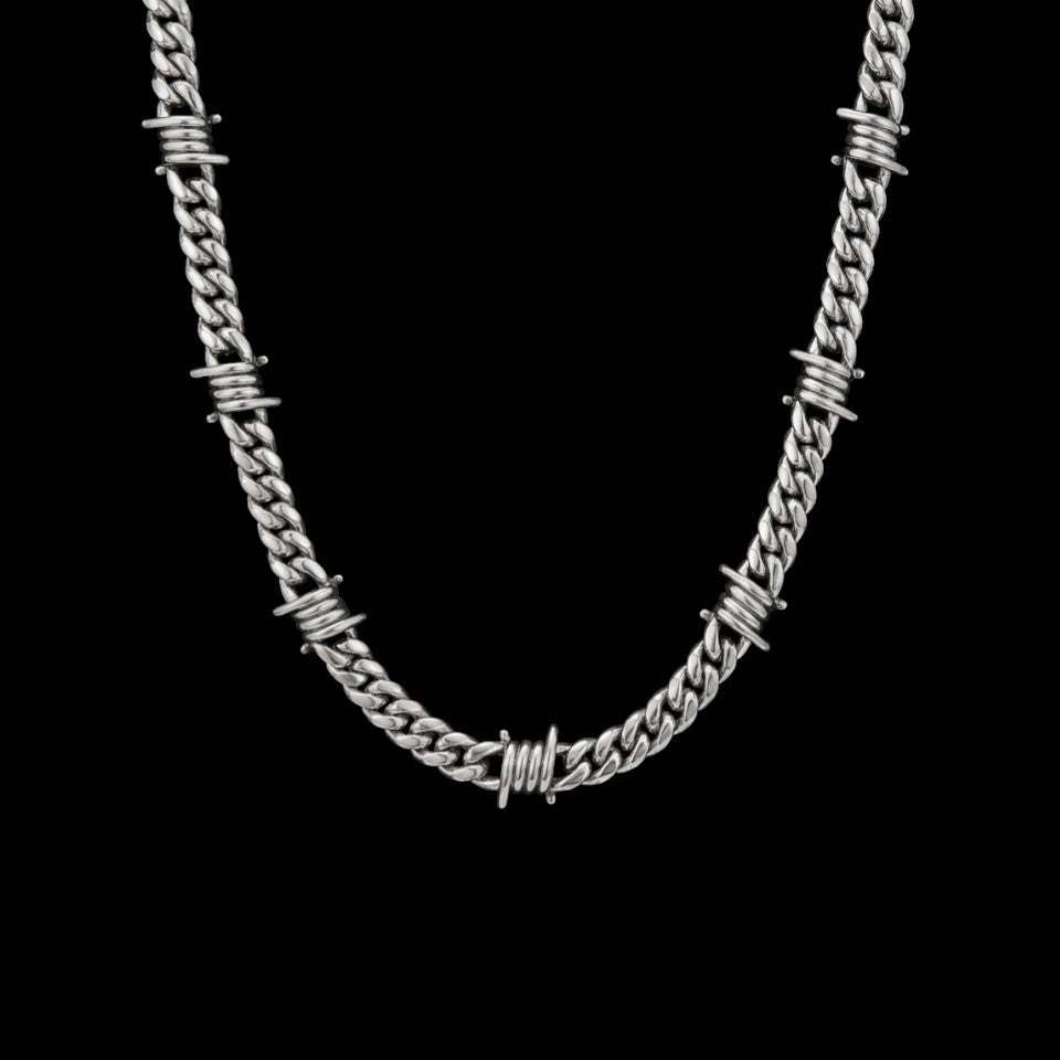 9mm barbed wire Cuban link stainless steel chain on a black background