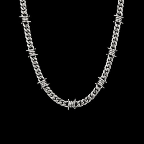 9mm barbed wire Cuban link stainless steel chain on a black background