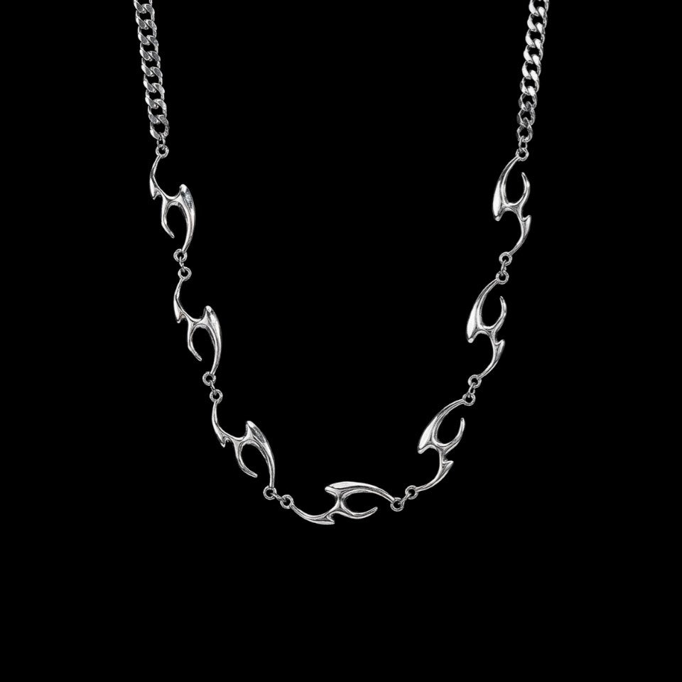 Lacerate stainless steel necklace on a black background