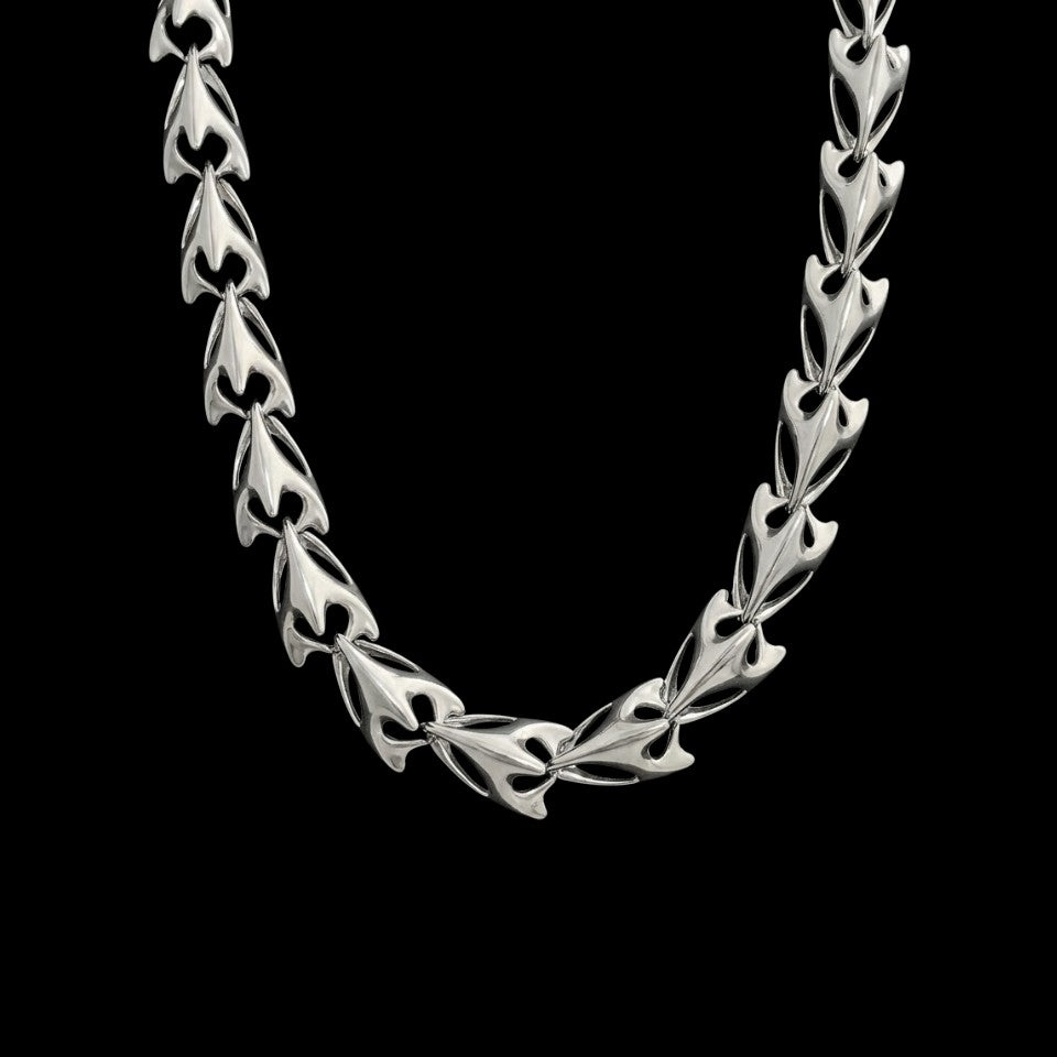 Predator stainless steel chain necklace on a black background
