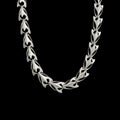 Predator stainless steel chain necklace on a black background