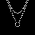 Layered O-chain stainless steel necklace on a black background