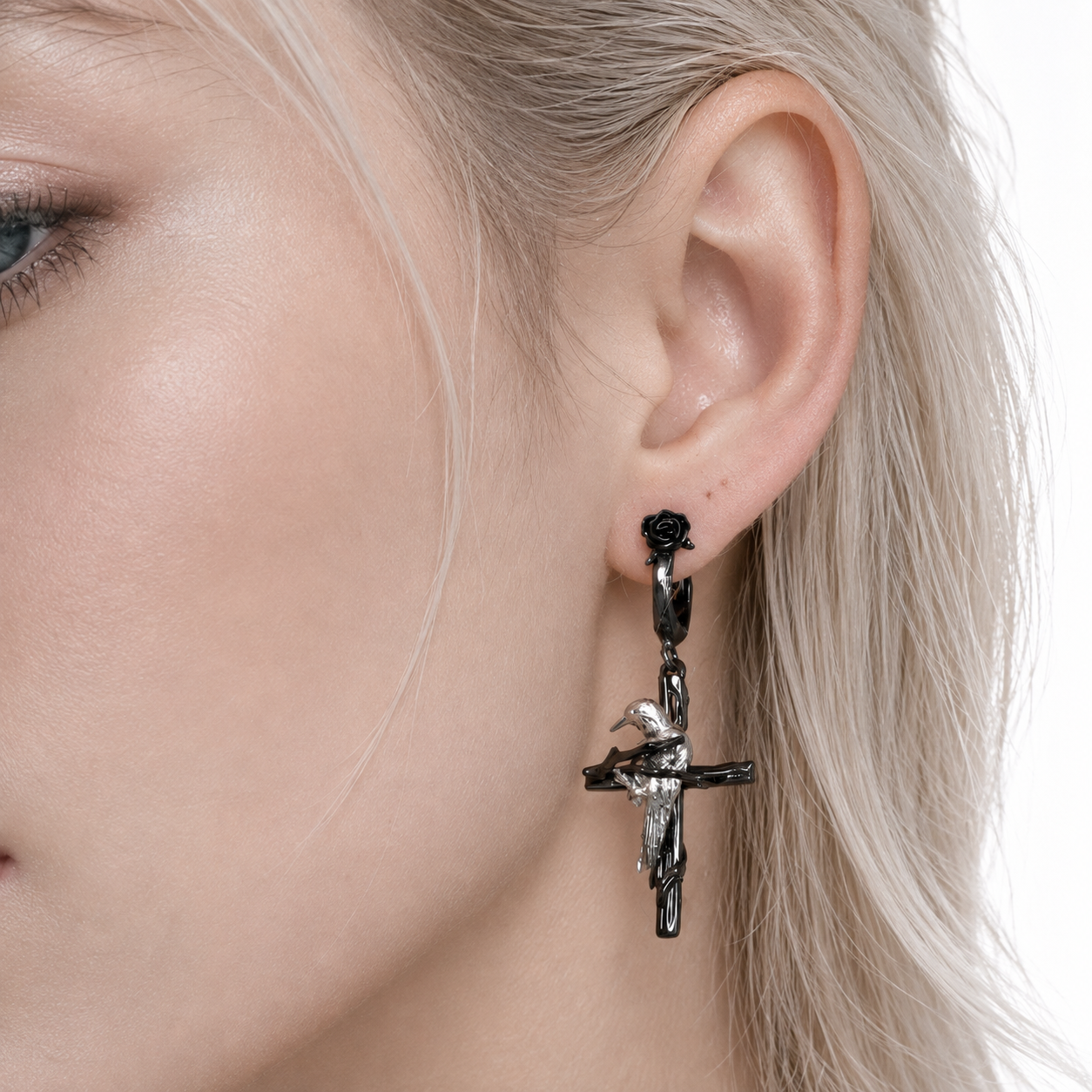 Raven Relic Cross Drop Earrings in black and silver – styling view