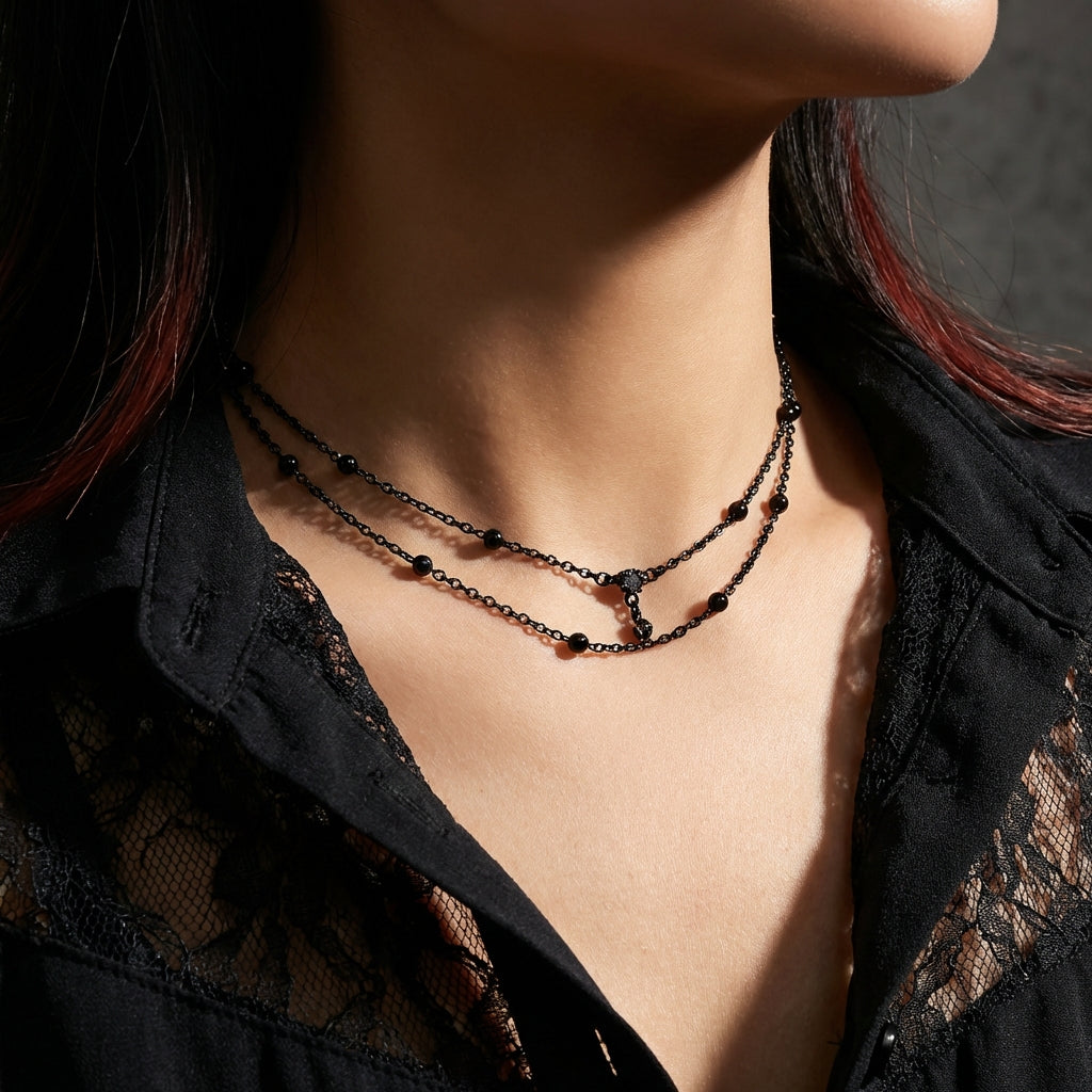 Shadow bead black stainless steel chain choker on a black background